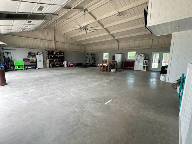 garage featuring metal wall and a ceiling fan