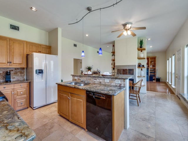 kitchen with visible vents, stone counters, decorative backsplash, white refrigerator with ice dispenser, and dishwasher