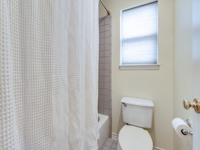 full bathroom with tile patterned floors, baseboards, toilet, and shower / tub combo