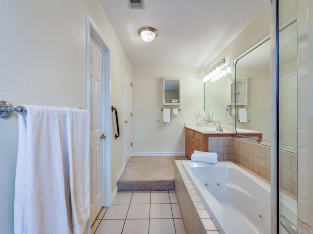 full bathroom featuring visible vents, a jetted tub, tile patterned flooring, baseboards, and vanity