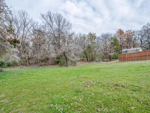 view of yard with fence