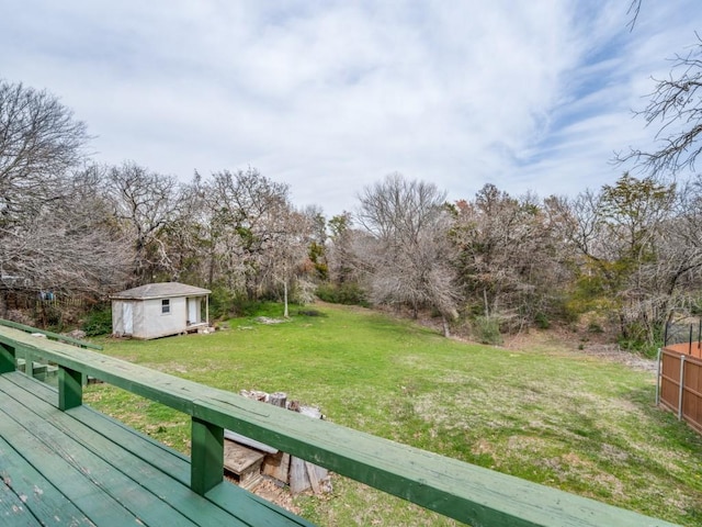 view of yard featuring an outbuilding and a deck