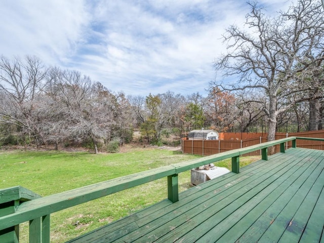 deck featuring a lawn and fence