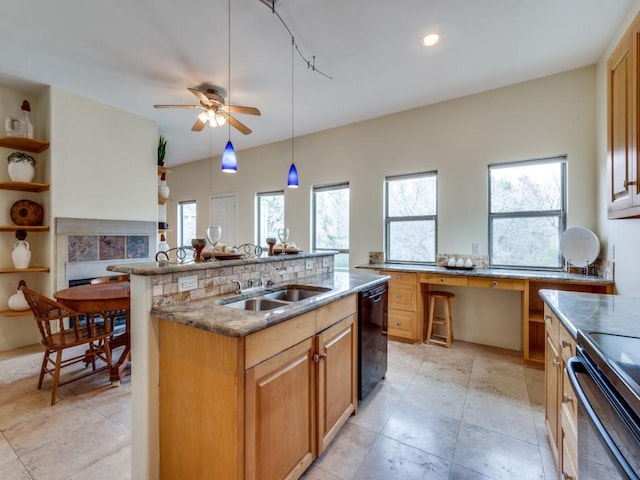 kitchen with black appliances, a healthy amount of sunlight, built in desk, and a sink