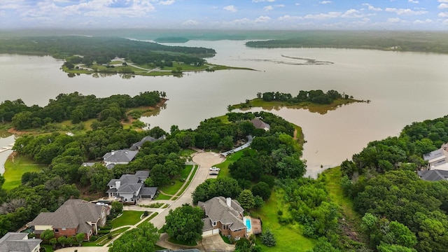 birds eye view of property with a water view and a residential view