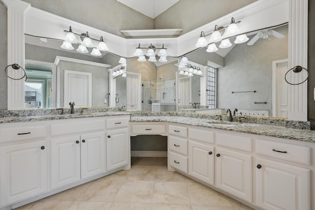 bathroom with a sink, a shower stall, lofted ceiling, and two vanities