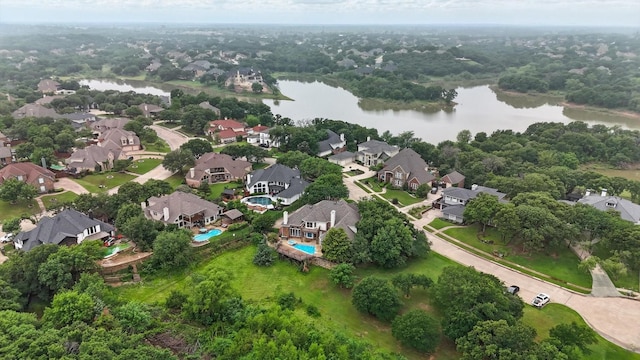birds eye view of property with a residential view and a water view