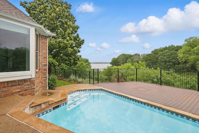 view of swimming pool with a fenced in pool, fence, and a wooden deck