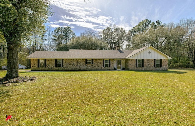 504 Mockingbird Ln, Logansport, LA 71049 - ranch-style home featuring brick siding, a chimney, and a front lawn