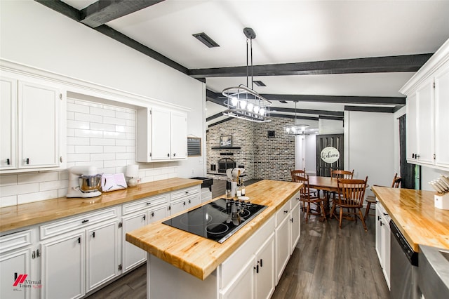 504 Mockingbird Ln, Logansport, LA 71049 - kitchen with dark wood-type flooring, white cabinets, wood counters, black electric stovetop, and backsplash
