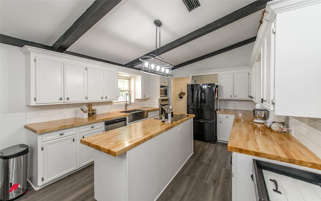 504 Mockingbird Ln, Logansport, LA 71049 - kitchen featuring visible vents, wooden counters, appliances with stainless steel finishes, and a center island