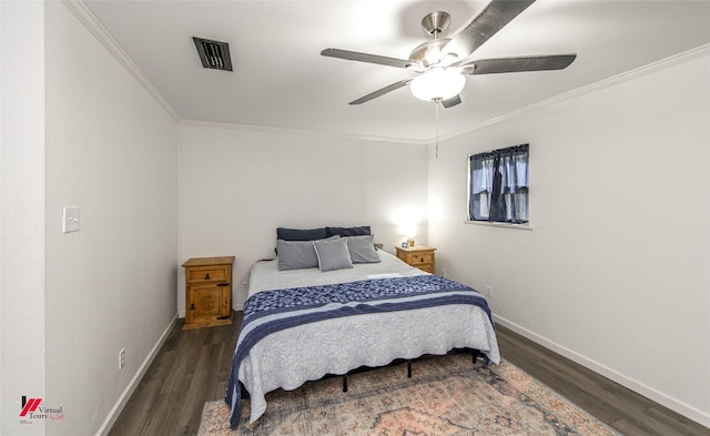 504 Mockingbird Ln, Logansport, LA 71049 - bedroom featuring visible vents, baseboards, wood finished floors, and ornamental molding