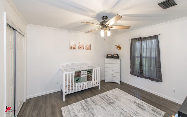 504 Mockingbird Ln, Logansport, LA 71049 - unfurnished bedroom featuring baseboards, wood finished floors, visible vents, and ornamental molding