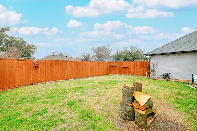 view of yard with a fenced backyard