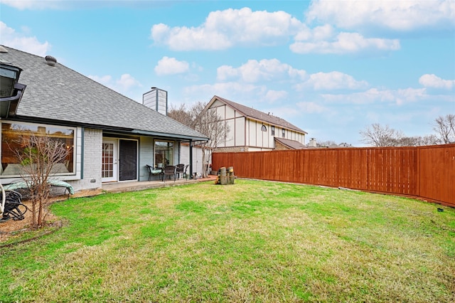 view of yard featuring a patio and fence