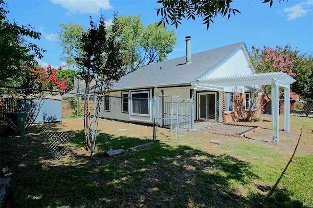 rear view of house featuring a gate, a pergola, a patio, a fenced backyard, and a yard