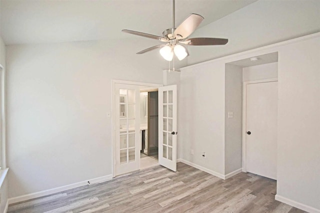 unfurnished bedroom with a ceiling fan, wood finished floors, french doors, and baseboards