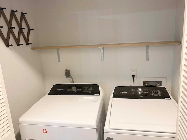 laundry area with washer and clothes dryer and laundry area