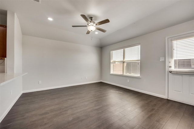 spare room with recessed lighting, baseboards, dark wood-type flooring, and a ceiling fan