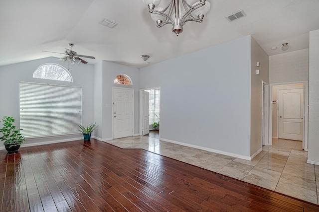 entrance foyer with wood finished floors, visible vents, and a wealth of natural light