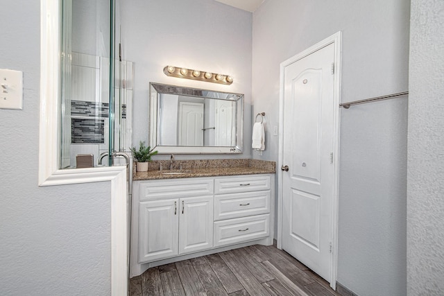 bathroom featuring wood finished floors and vanity
