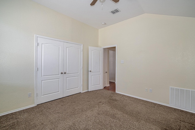 unfurnished bedroom with visible vents, carpet flooring, ceiling fan, and vaulted ceiling