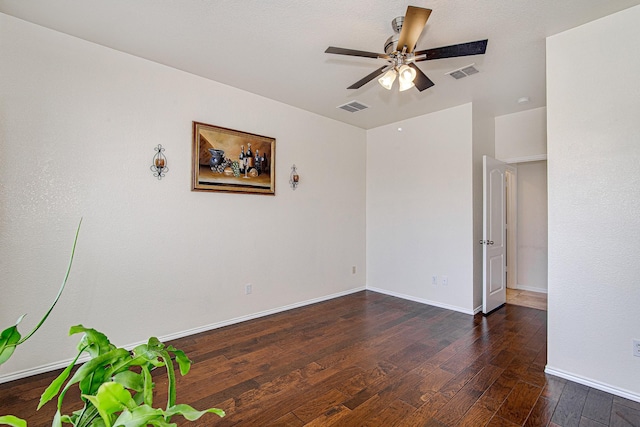 unfurnished room with visible vents, ceiling fan, baseboards, and hardwood / wood-style floors