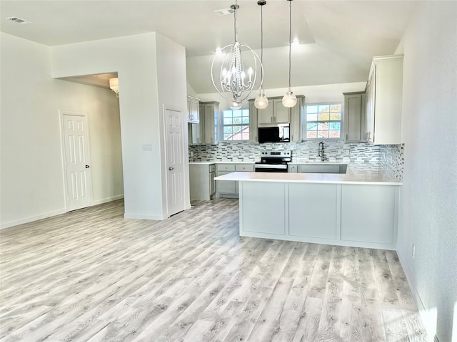 kitchen with visible vents, backsplash, stainless steel electric range, and light wood-style flooring