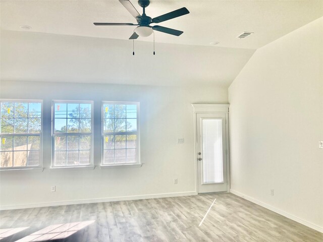 spare room with visible vents, a healthy amount of sunlight, and light wood-type flooring