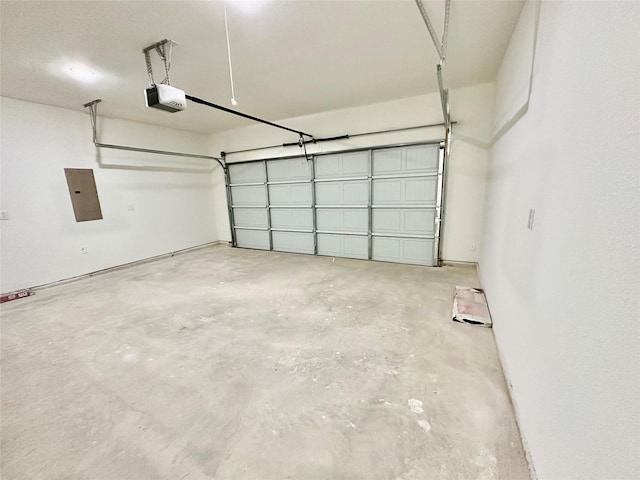 garage with electric panel and a garage door opener