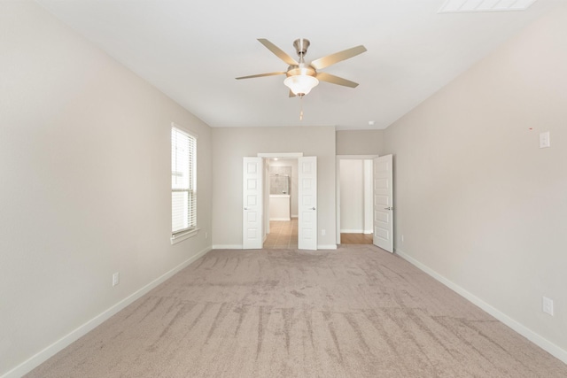 unfurnished bedroom featuring carpet flooring, visible vents, and baseboards