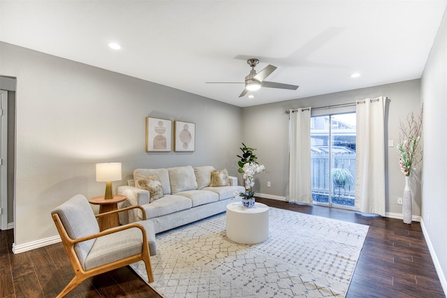 living area with wood finished floors and baseboards