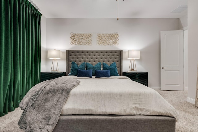 bedroom with carpet and baseboards