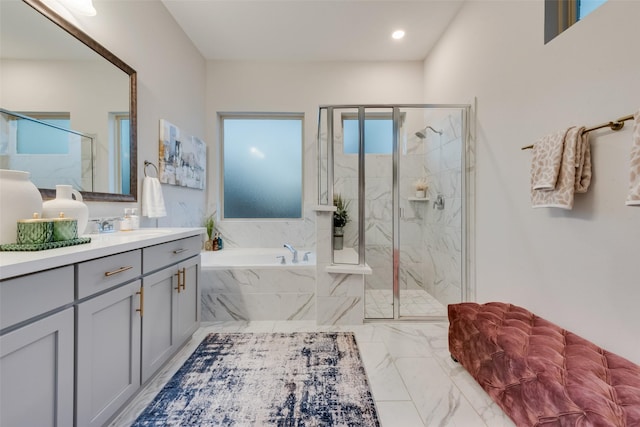 full bathroom featuring a marble finish shower, recessed lighting, a bath, marble finish floor, and vanity