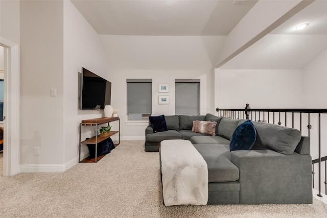 living area featuring lofted ceiling, carpet, and baseboards