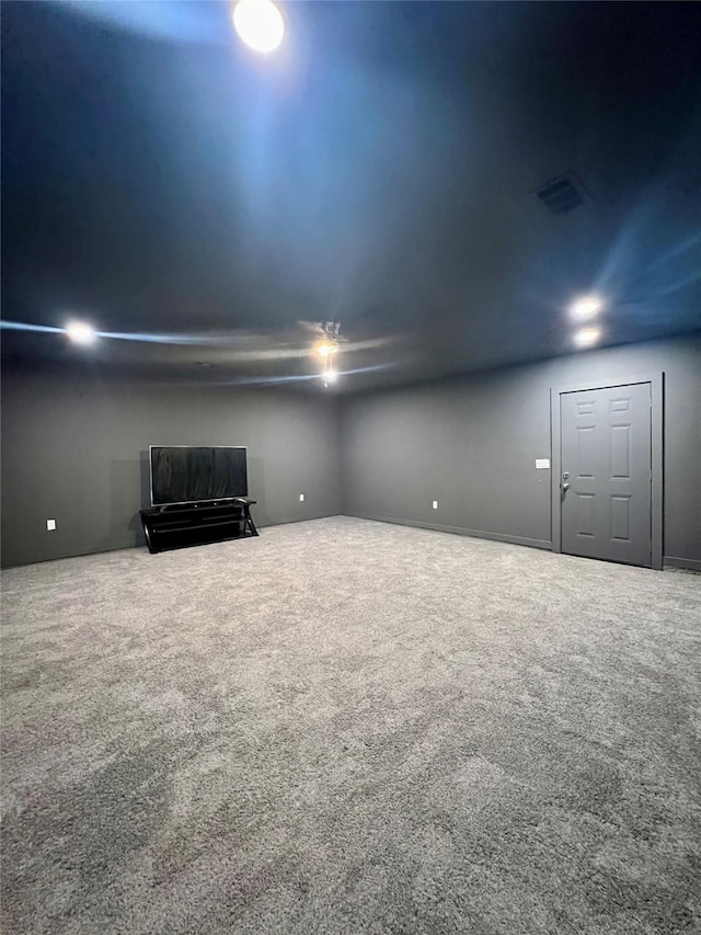 unfurnished living room featuring visible vents and carpet floors