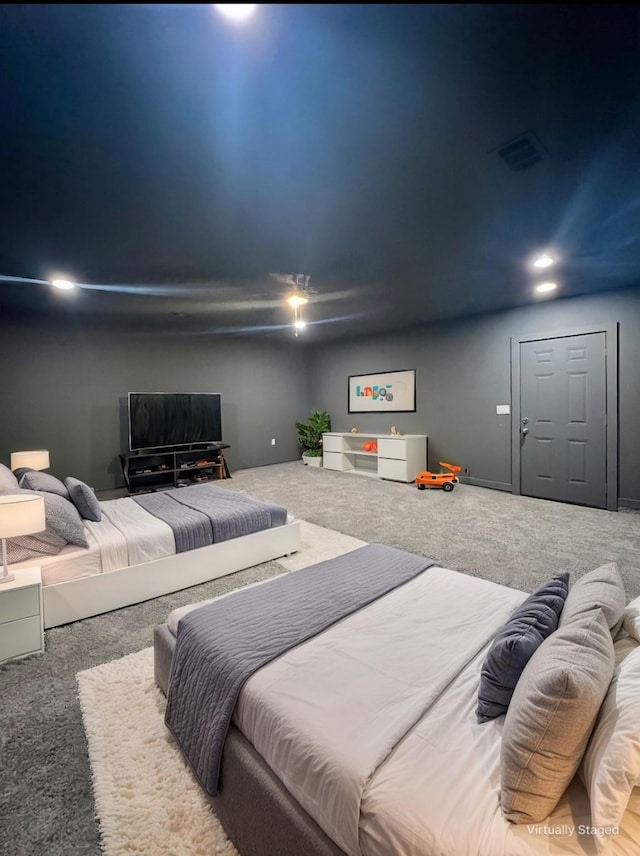 carpeted bedroom featuring visible vents