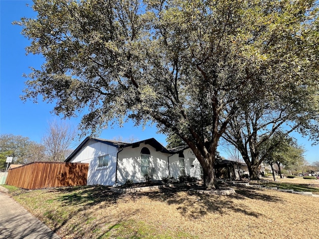 view of side of property with fence