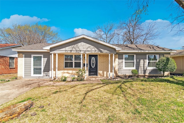 single story home with brick siding and a front lawn