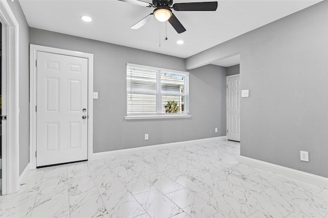 interior space with recessed lighting, baseboards, marble finish floor, and ceiling fan