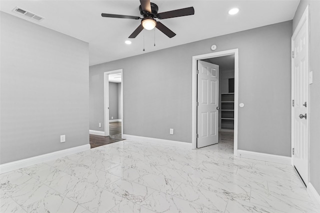 unfurnished bedroom with visible vents, baseboards, recessed lighting, marble finish floor, and a ceiling fan