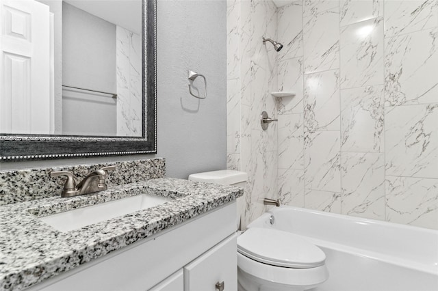 bathroom featuring vanity,  shower combination, toilet, and a textured wall