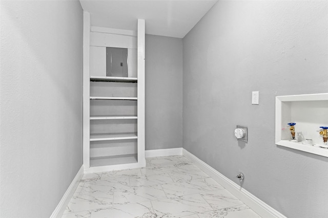 laundry area with baseboards, gas dryer hookup, washer hookup, electric panel, and marble finish floor