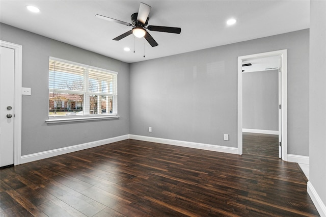 empty room with a ceiling fan, recessed lighting, wood finished floors, and baseboards