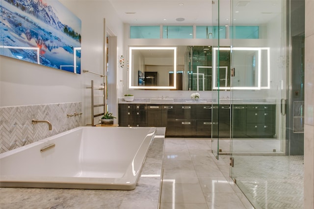 bathroom with vanity, a stall shower, and a freestanding bath