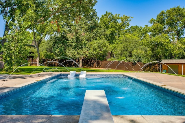 view of swimming pool with a patio area, a fenced in pool, a fenced backyard, and a diving board