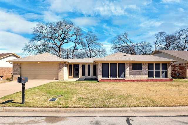 ranch-style home featuring driveway, roof with shingles, a front yard, a garage, and brick siding