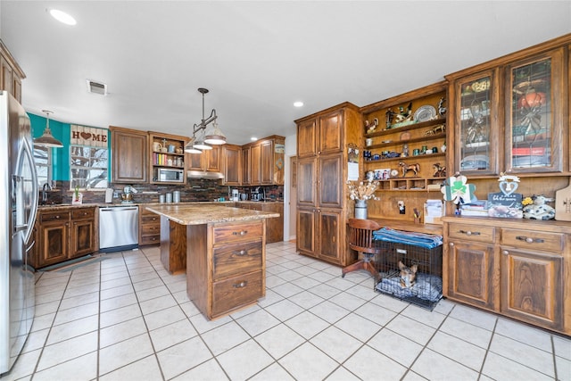 kitchen with open shelves, light tile patterned floors, visible vents, and stainless steel appliances