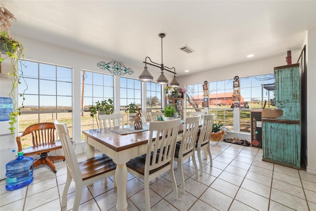 dining room with light tile patterned floors, visible vents, and recessed lighting