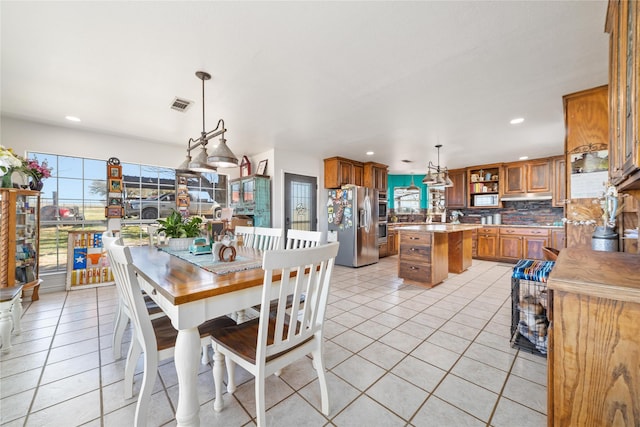 dining room featuring light tile patterned floors, visible vents, and recessed lighting